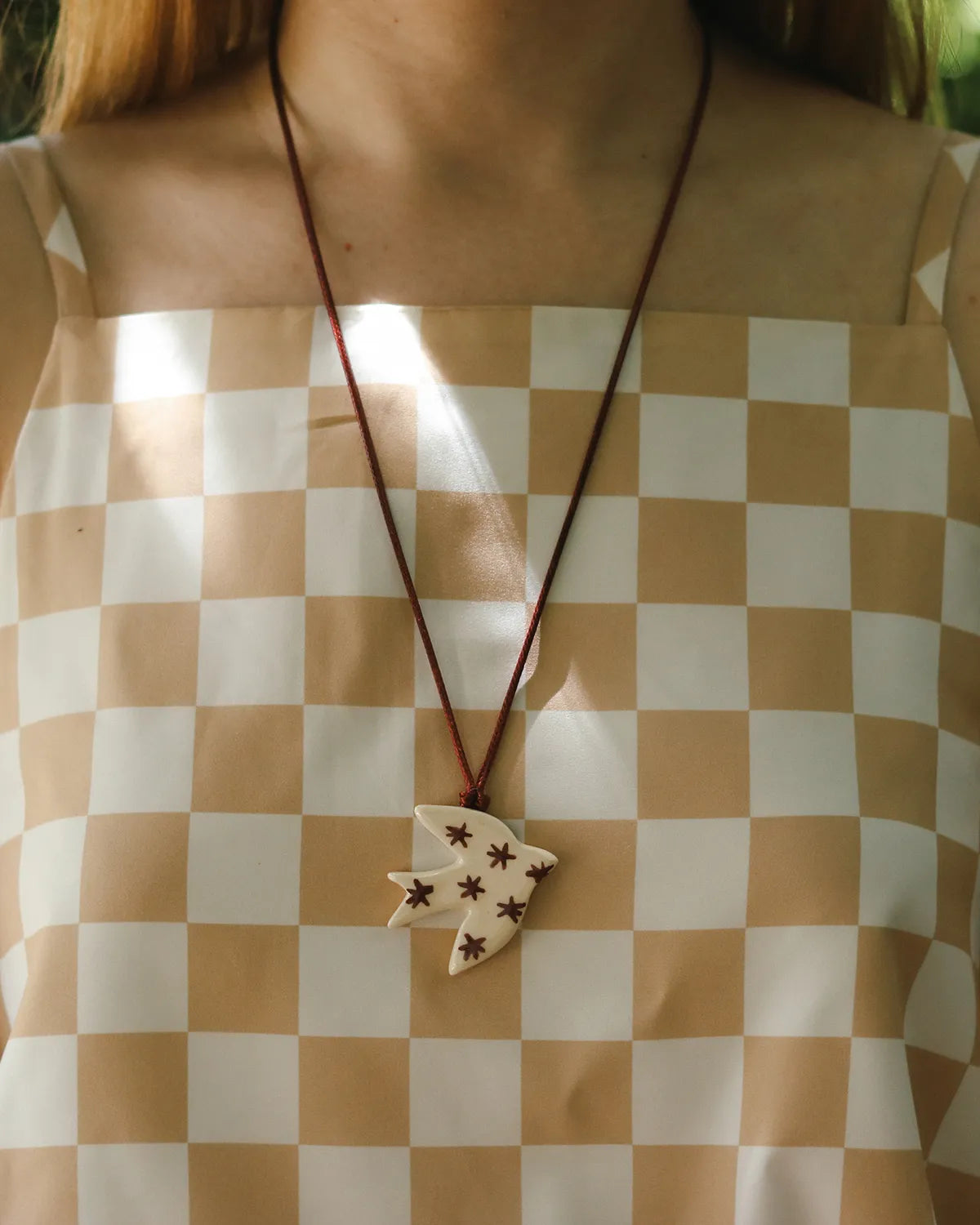 BEIGE & BURGUNDY SWALLOW PENDANT