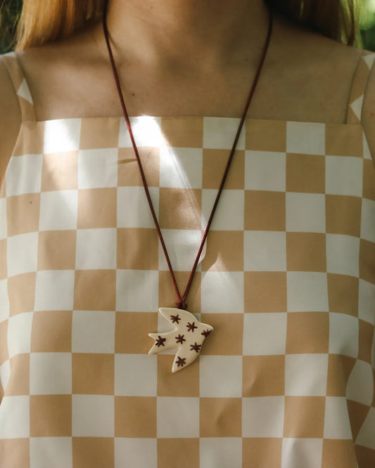 BEIGE & BURGUNDY SWALLOW PENDANT